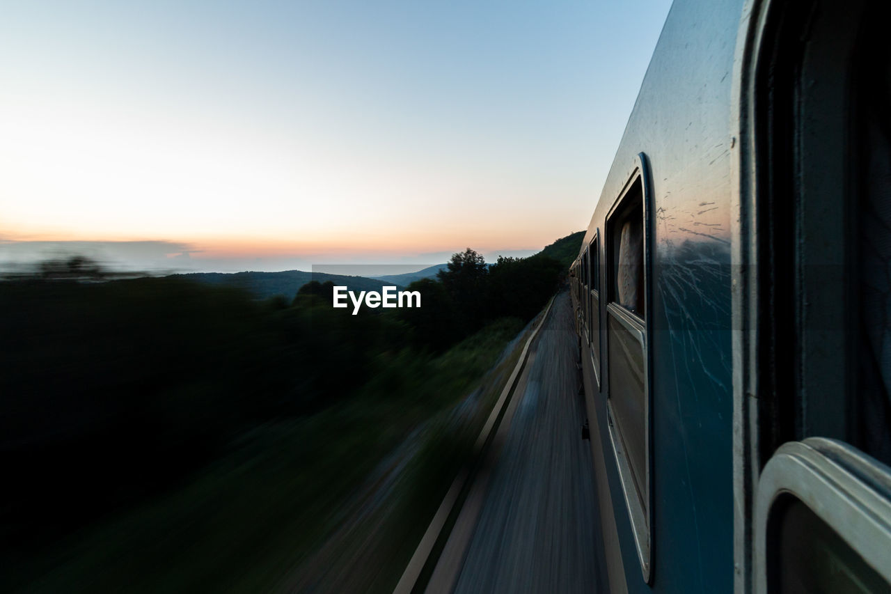 Train against sky at sunset