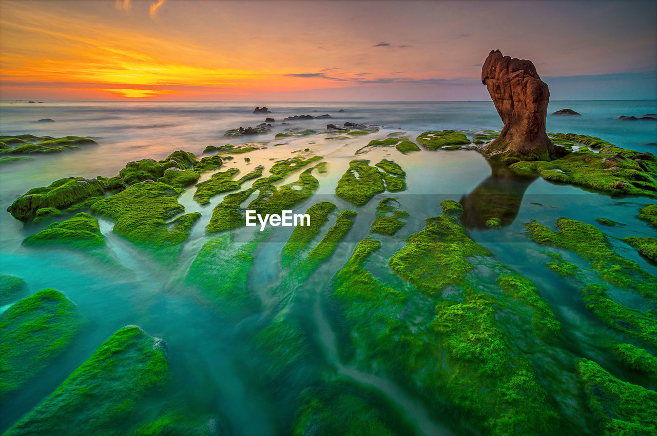 Scenic view of sea against sky during sunset