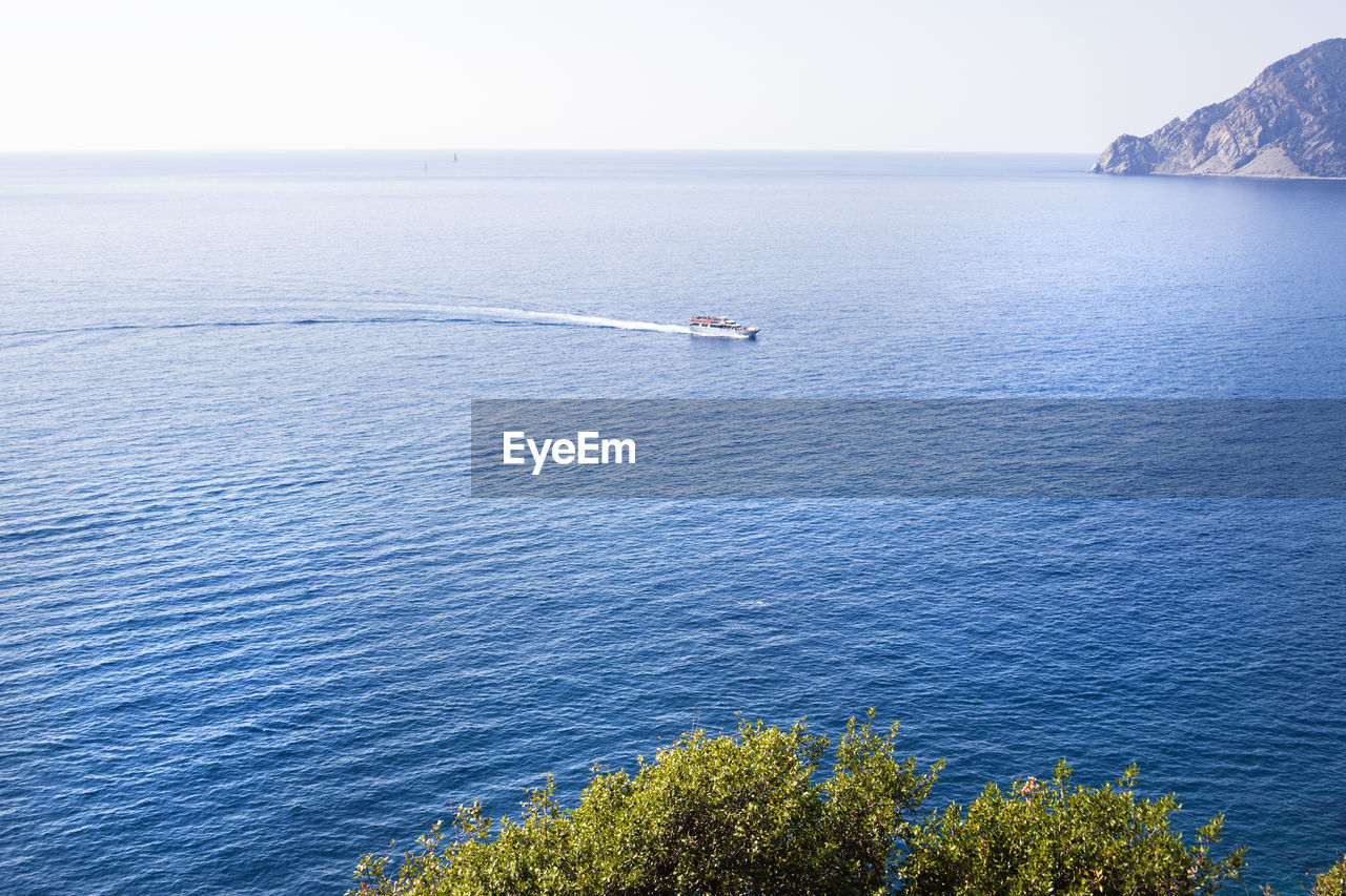 HIGH ANGLE VIEW OF BLUE SEA AGAINST SKY