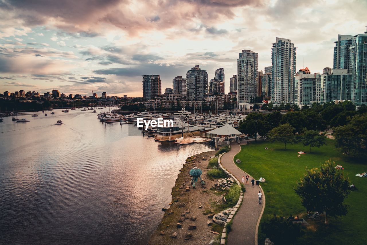 Panoramic view of city buildings against sky during sunset