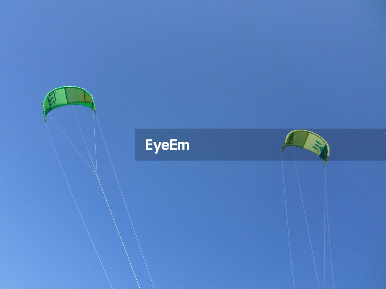 LOW ANGLE VIEW OF PARAGLIDING