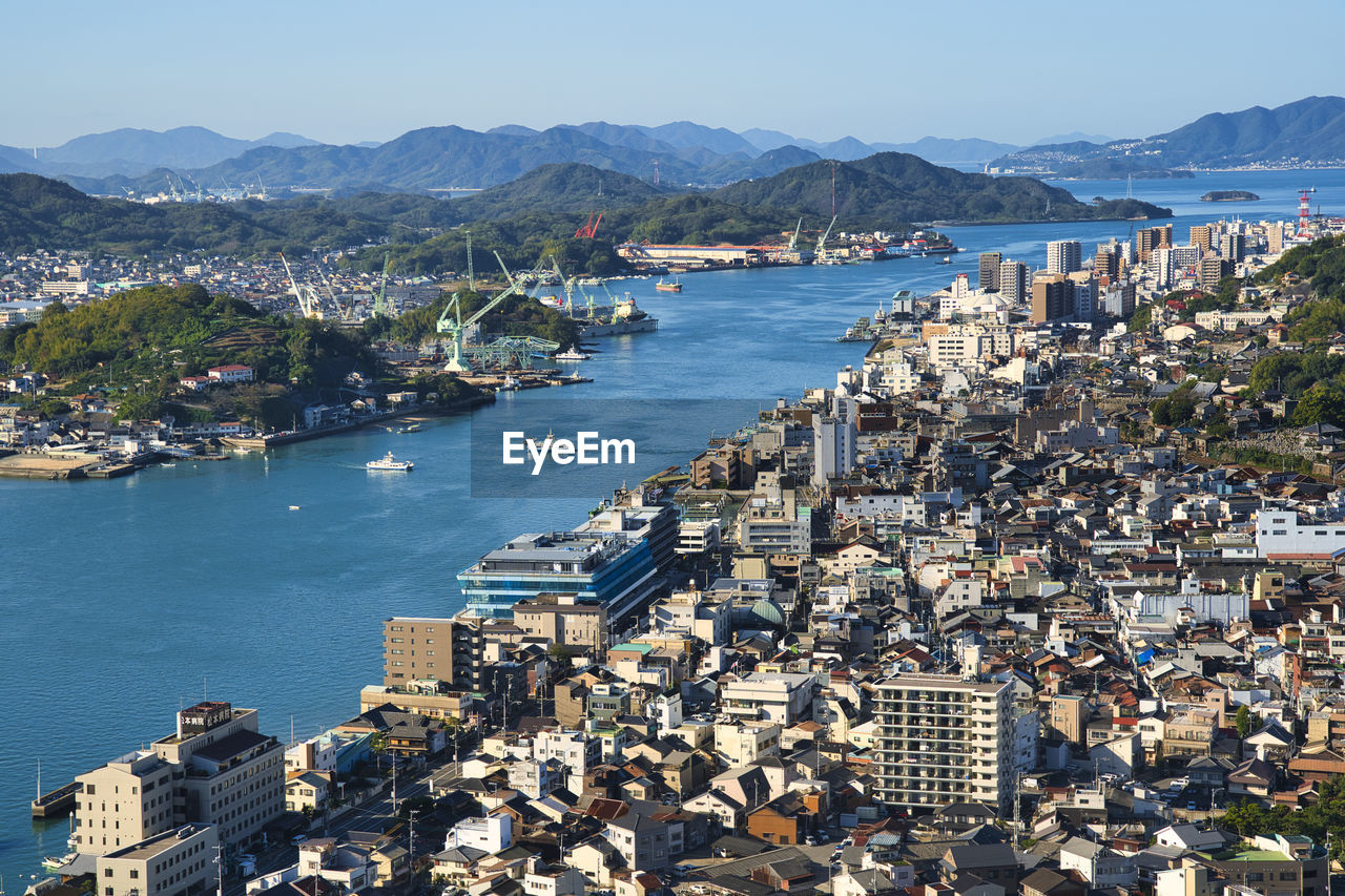 High angle view of onomichi city by sea against sky
