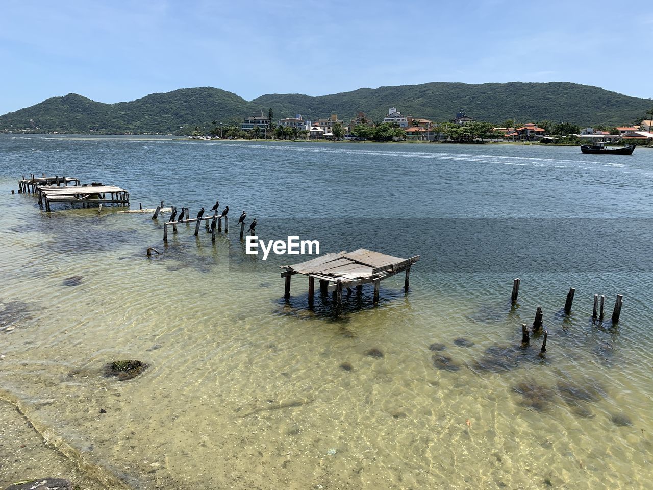 High angle view of wooden posts in lagoa lake against sky in florianapolis 