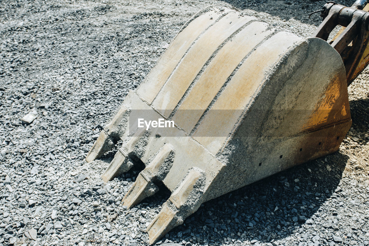 HIGH ANGLE VIEW OF TEXT ON ROAD BY LAND