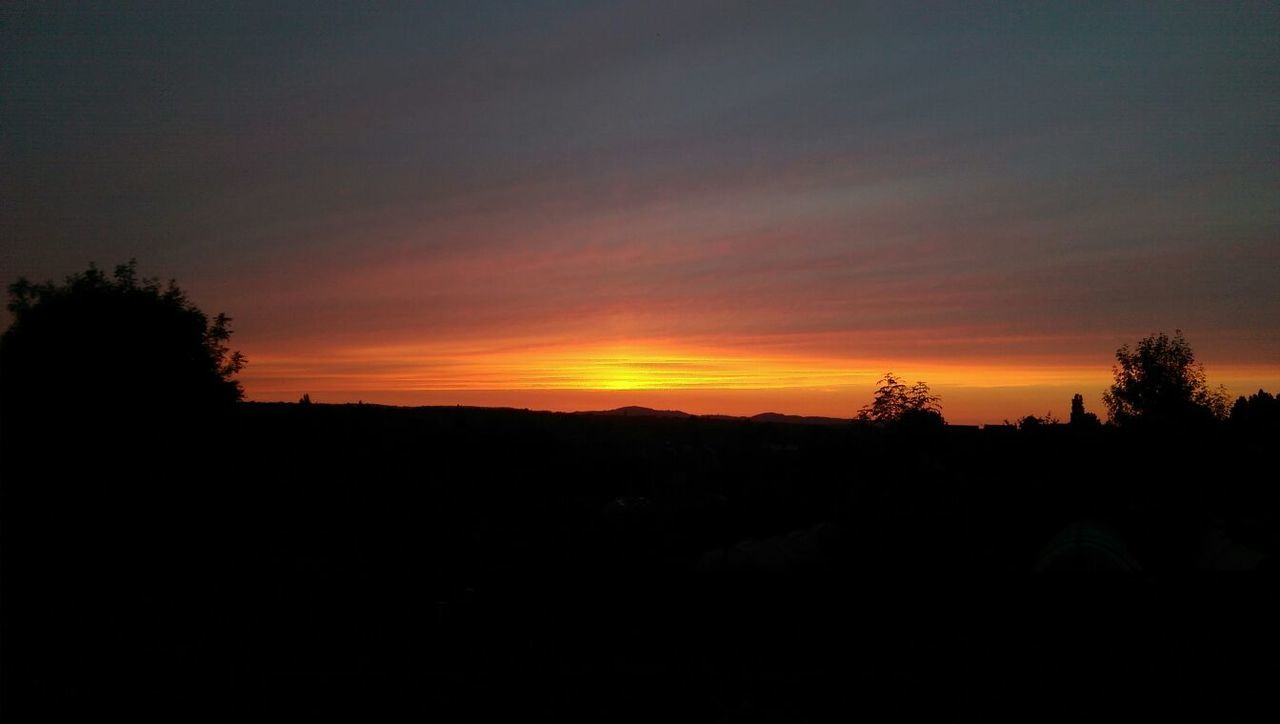 SILHOUETTE LANDSCAPE AGAINST SKY AT SUNSET