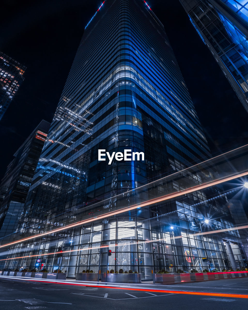 Illuminated modern buildings in city at night