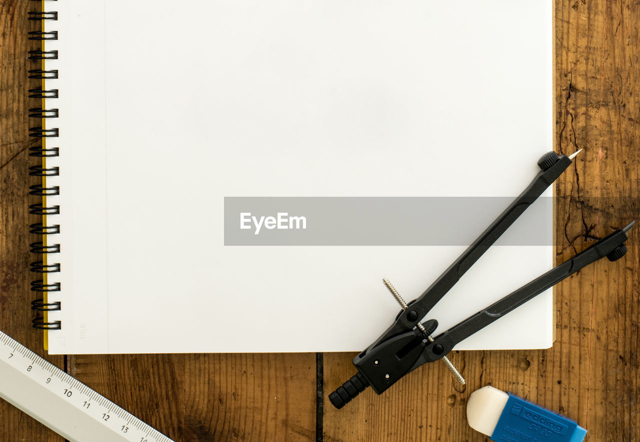 High angle view of pen and diary on table