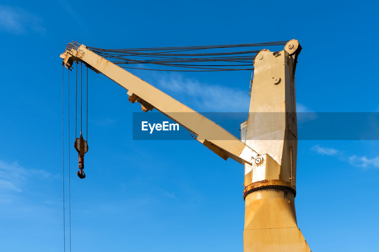 low angle view of crane against clear sky