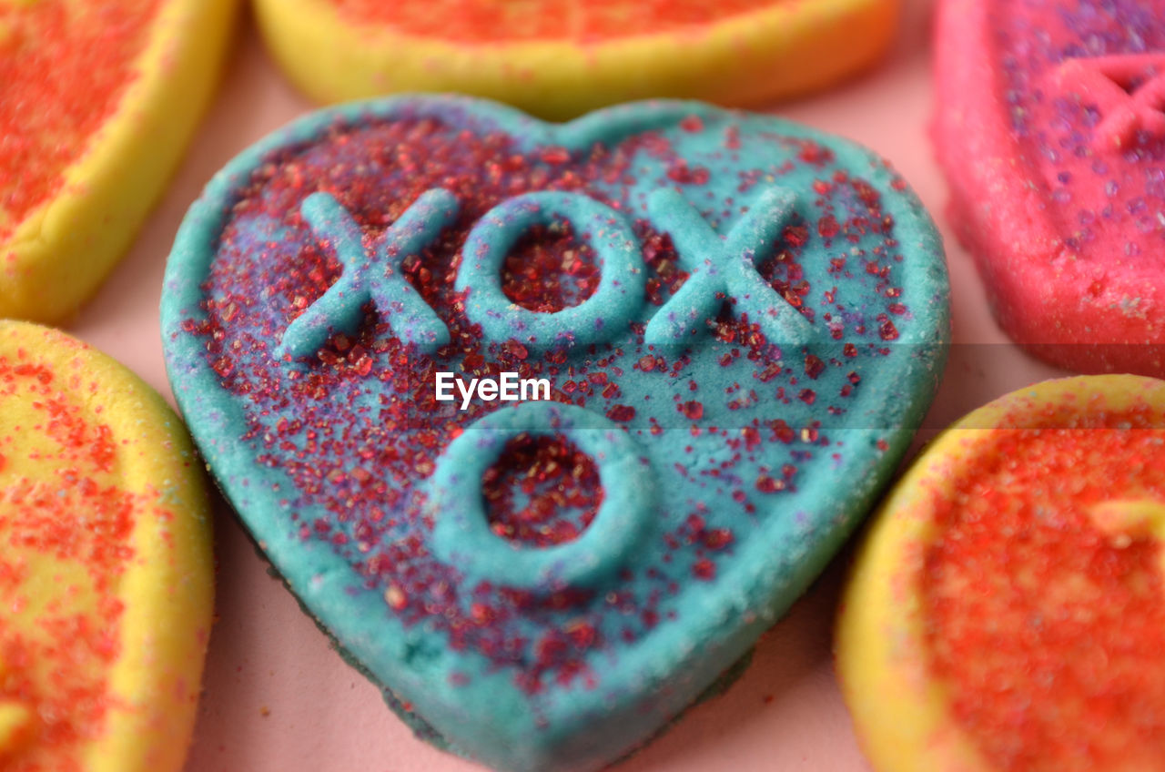 Xox means hugs and kisses on blue heart shape cookies for valentines day