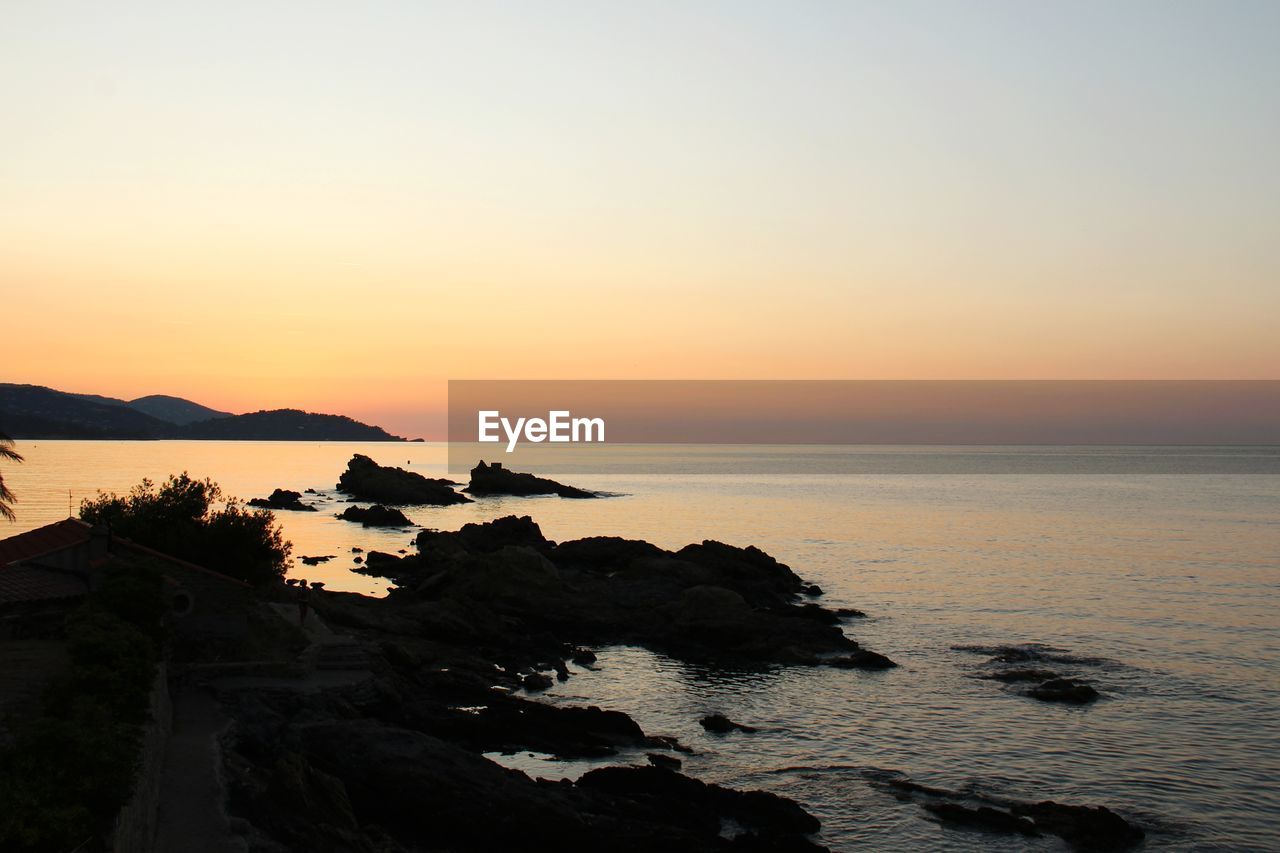 Scenic view of sea against sky during sunset