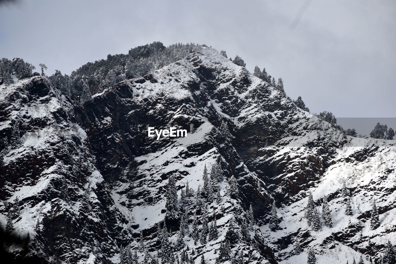 LOW ANGLE VIEW OF SNOWCAPPED MOUNTAIN