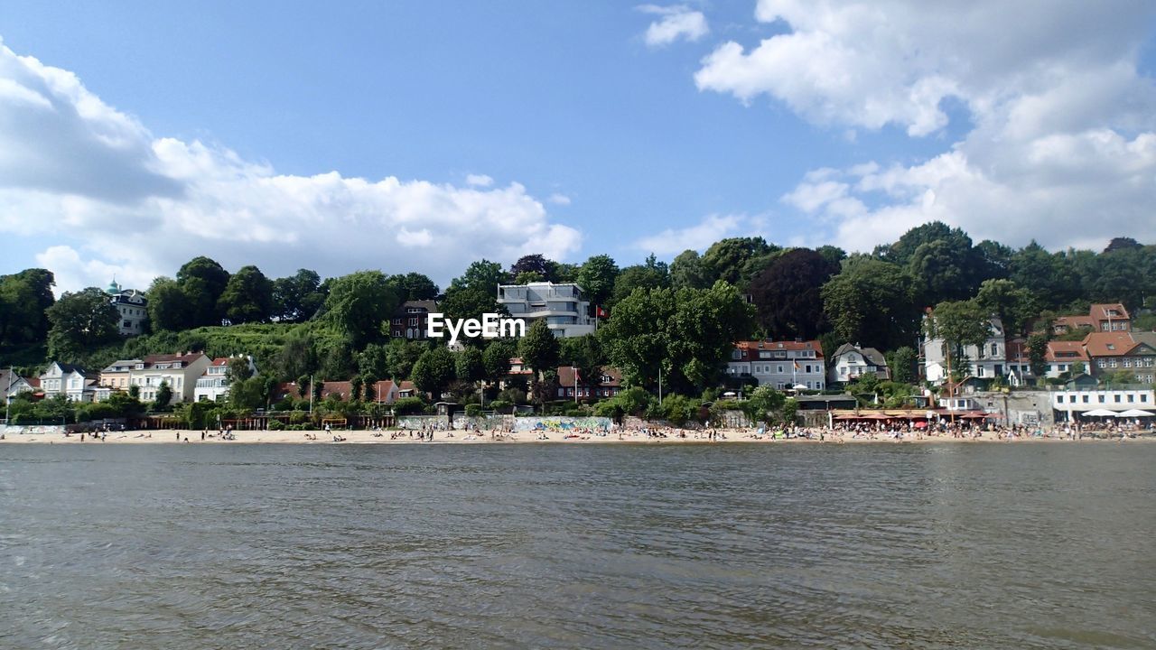 BUILDINGS BY SEA AGAINST SKY