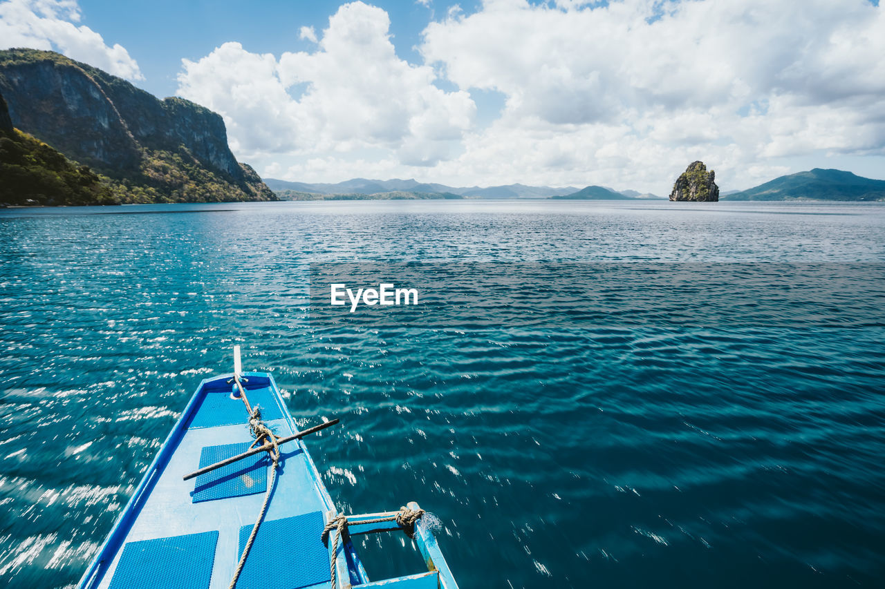 SCENIC VIEW OF SEA AND MOUNTAINS AGAINST SKY