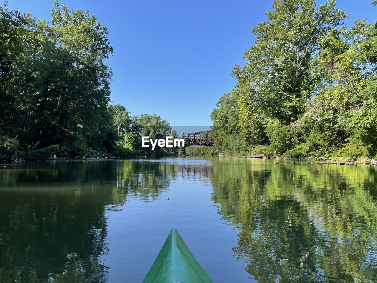 water, tree, plant, reflection, lake, nature, sky, beauty in nature, tranquility, scenics - nature, no people, body of water, blue, clear sky, tranquil scene, day, green, waterway, architecture, nautical vessel, outdoors, travel destinations, built structure, travel, transportation, growth, tourism, boat, non-urban scene, idyllic