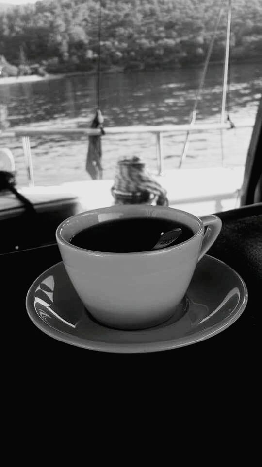 CLOSE-UP OF COFFEE CUP WITH COFFEE CUP