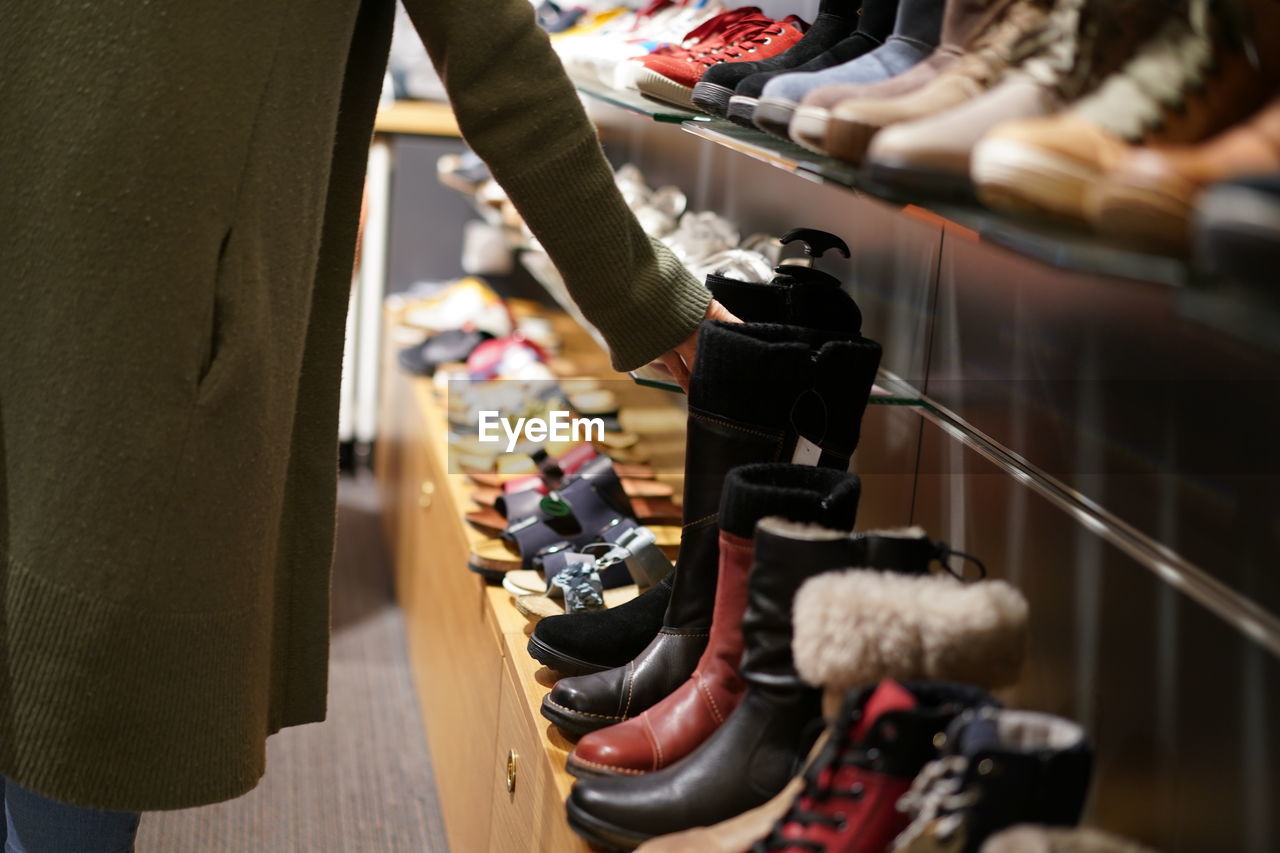 Low section of woman standing in store