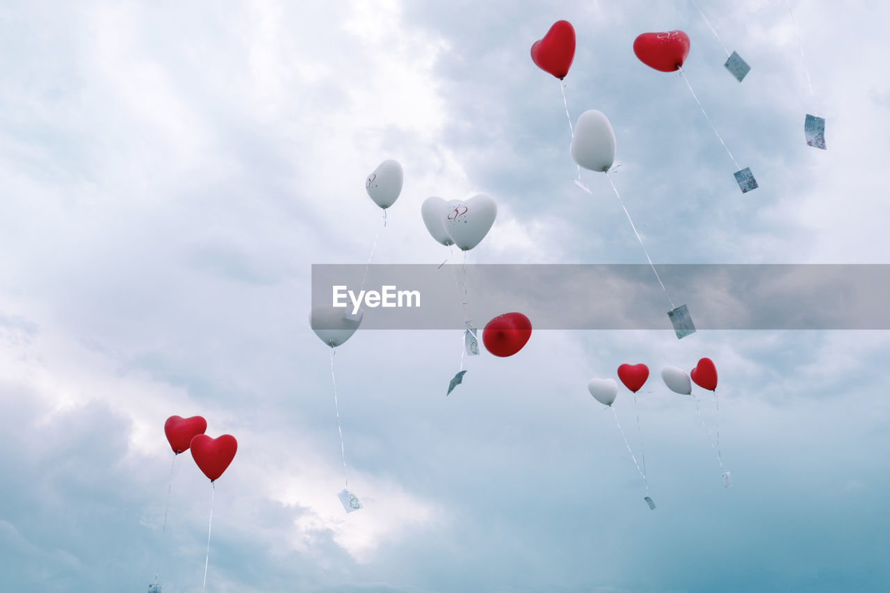 LOW ANGLE VIEW OF BALLOONS BALLOON AGAINST SKY