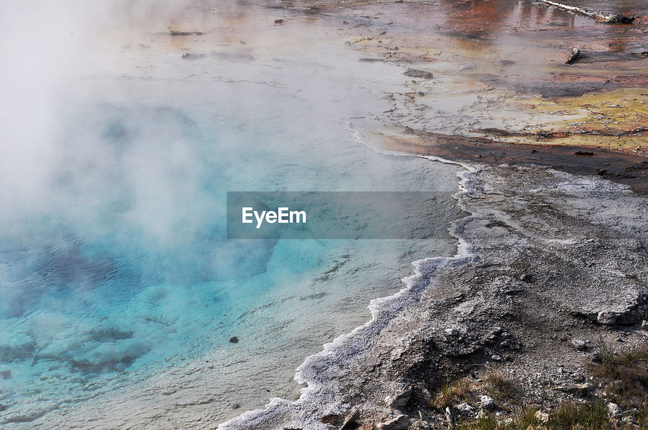 Scenic view of hot spring in volcanic landscape