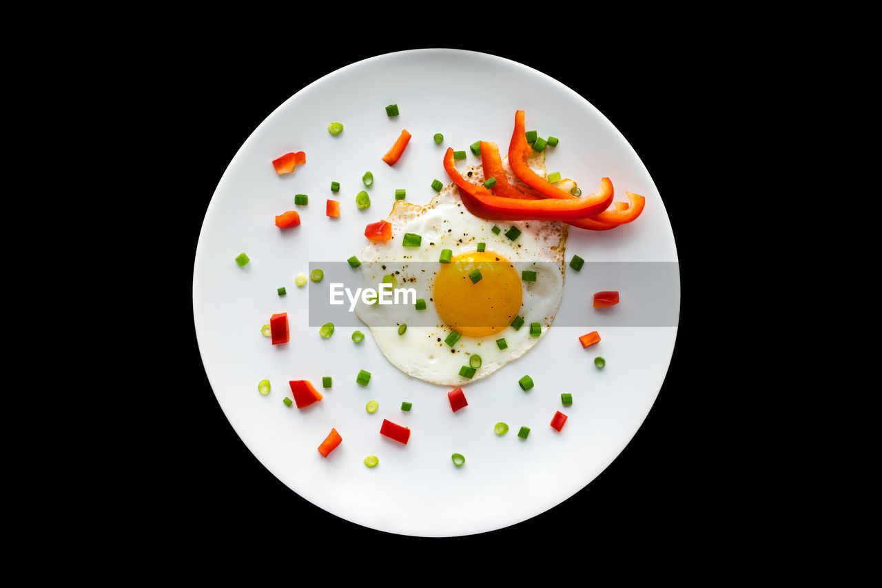 food, food and drink, black background, healthy eating, egg, studio shot, plate, wellbeing, fried egg, freshness, vegetable, meal, indoors, no people, fried, tomato, breakfast, fruit, egg yolk, produce