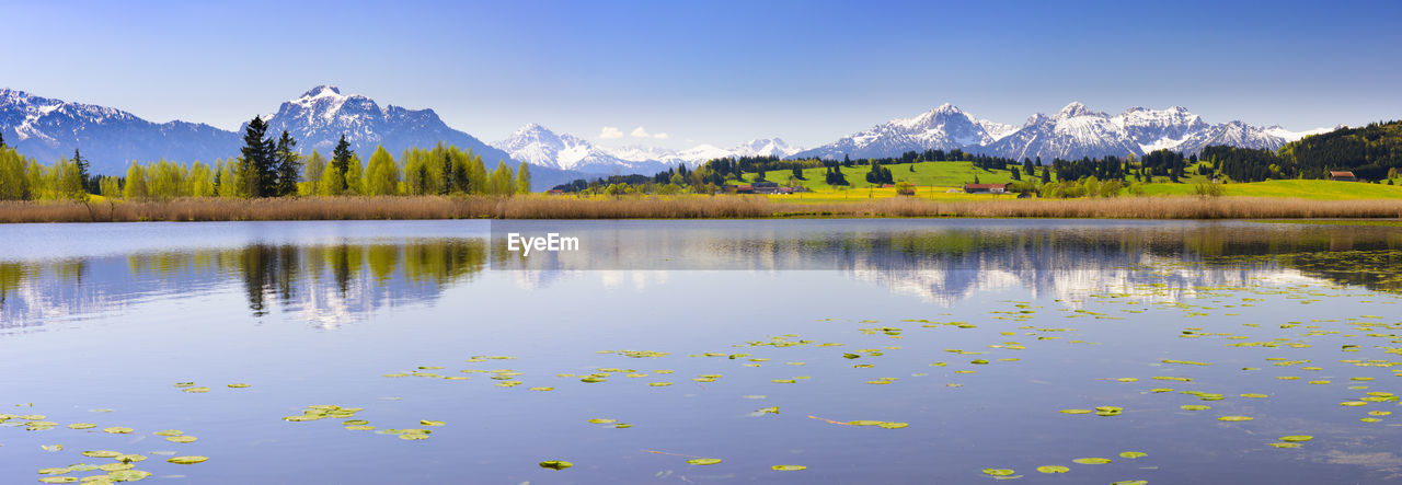 Wide angle view to mountain range with reflection in lake in bavaria