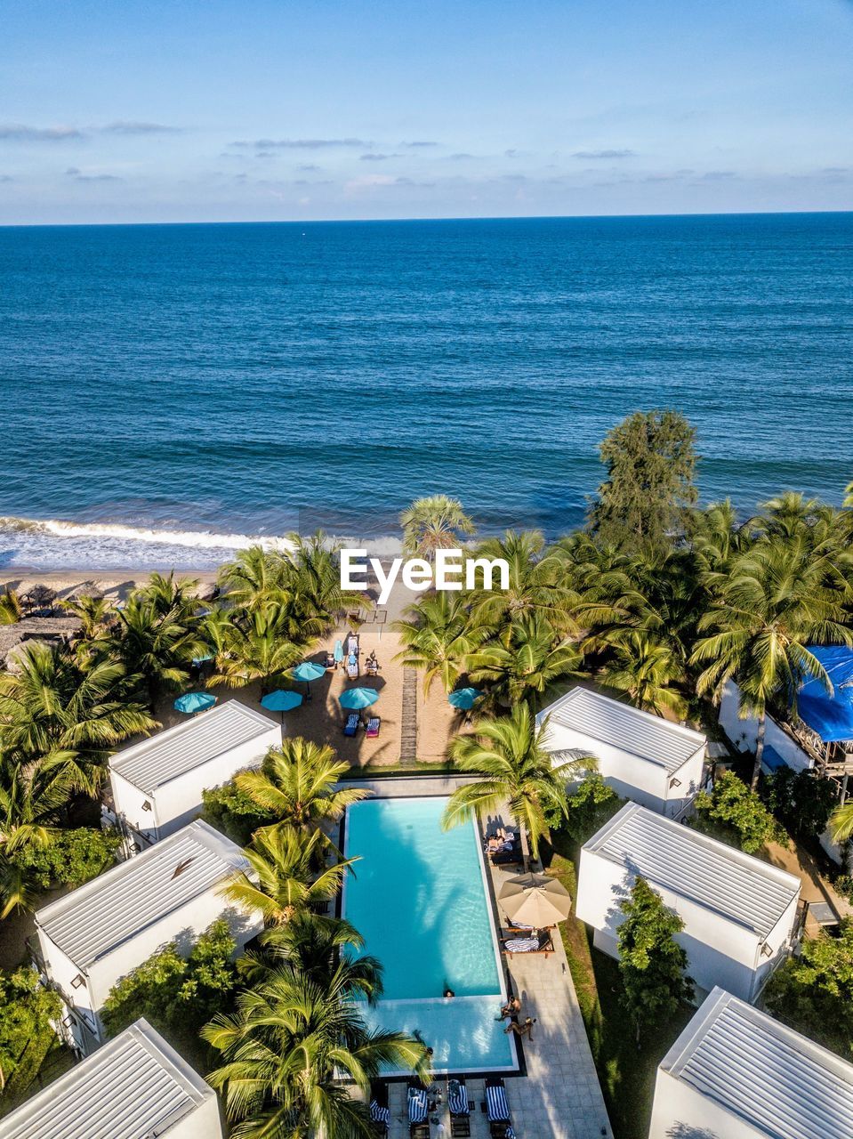 HIGH ANGLE VIEW OF SWIMMING POOL AGAINST SKY