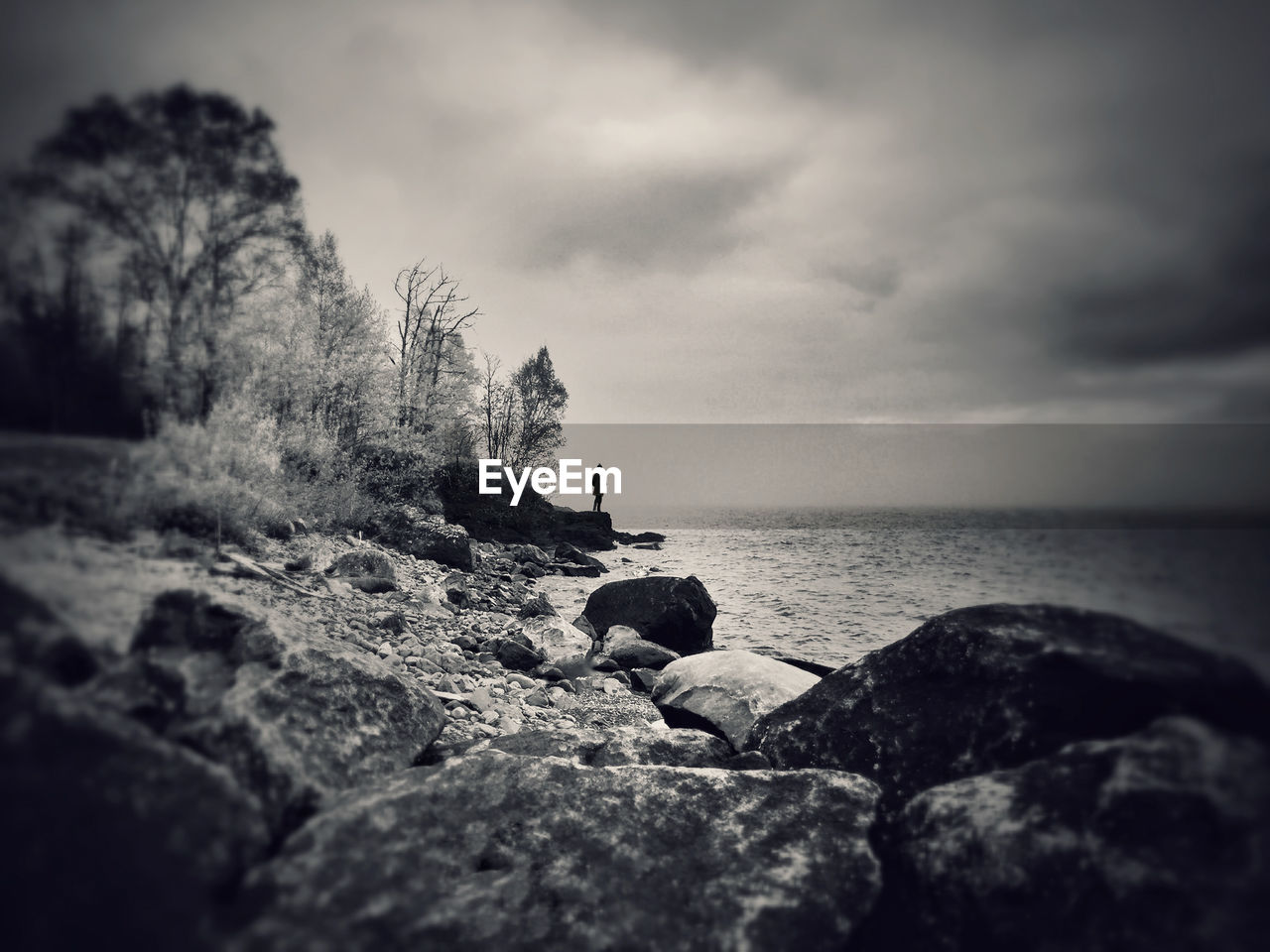 SCENIC VIEW OF SEA WITH ROCKS IN BACKGROUND