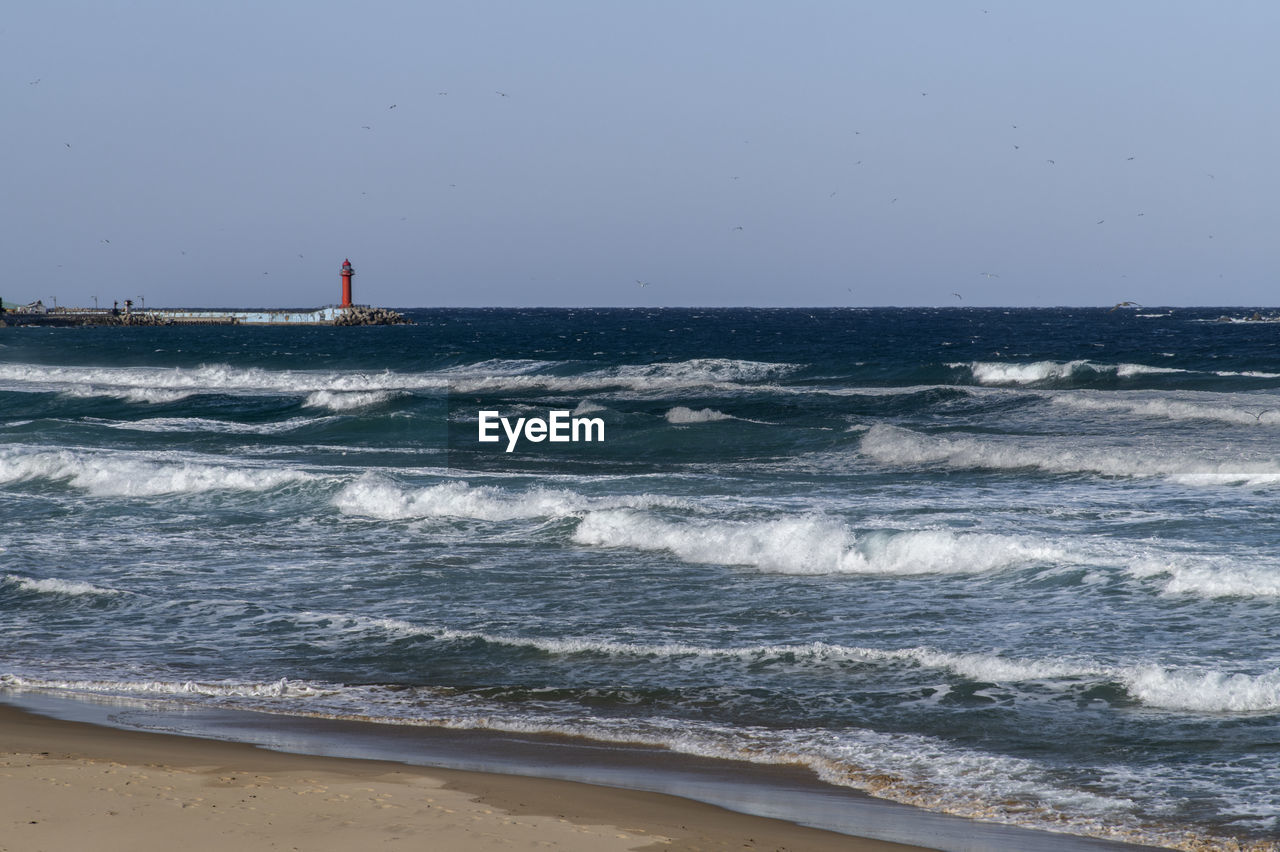 Scenic view of sea against clear sky