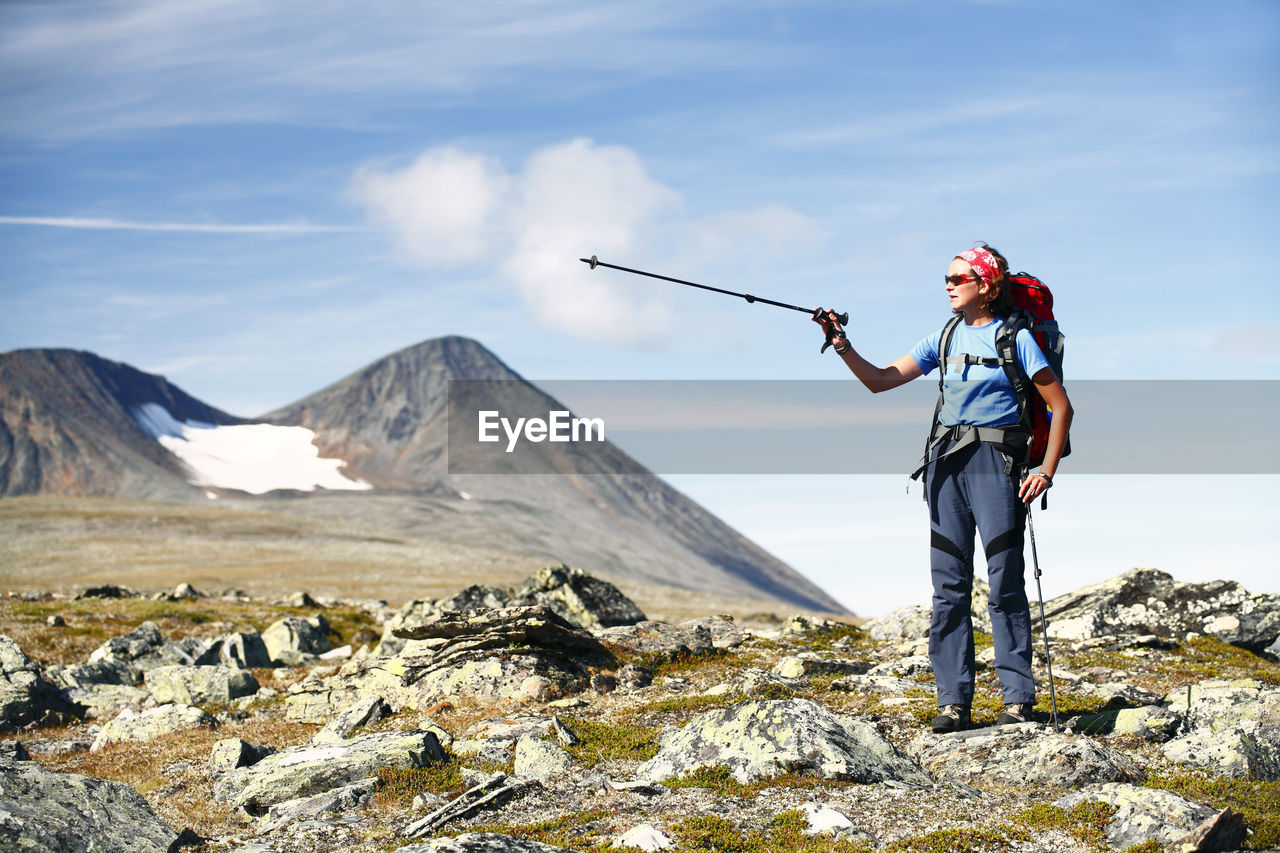 Female hiker with mountain in background