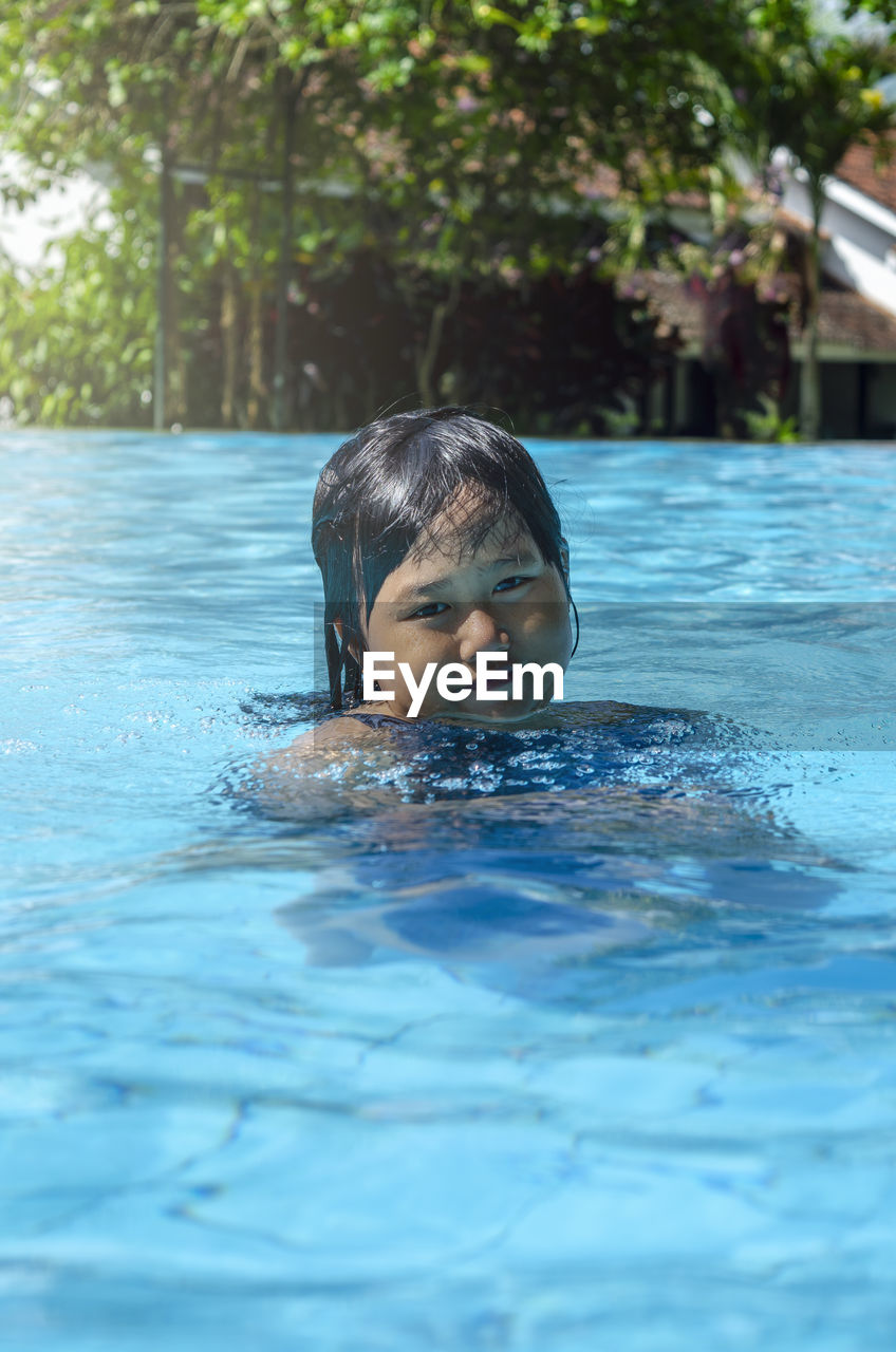 Portrait of girl in swimming pool