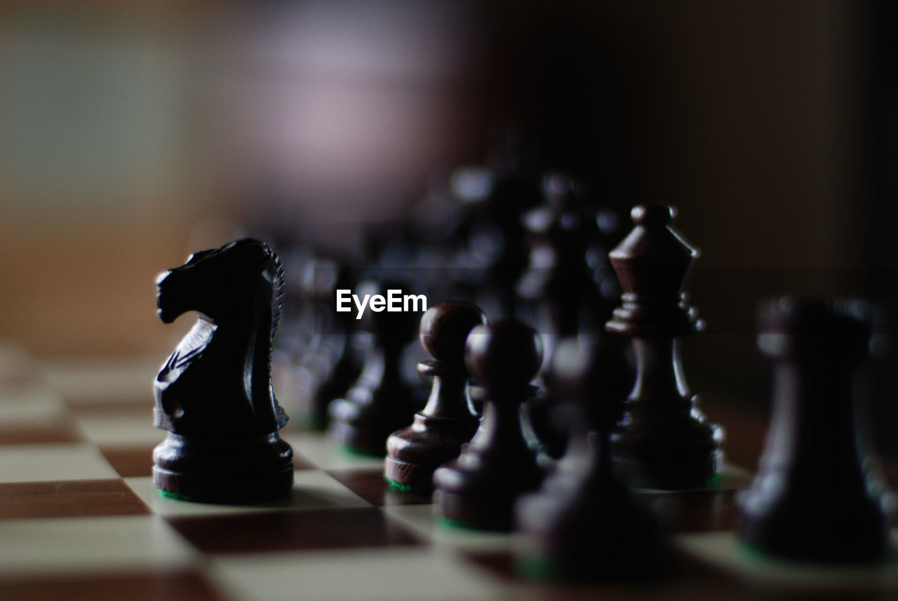 Close-up of chess pieces on board