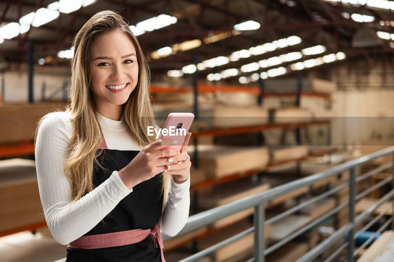 portrait of young woman using mobile phone