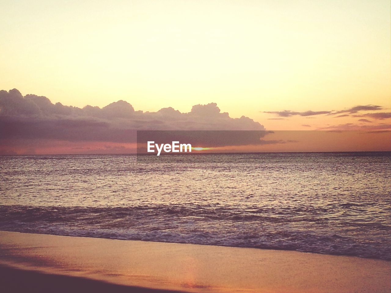 Scenic view of sea against sky at sunset
