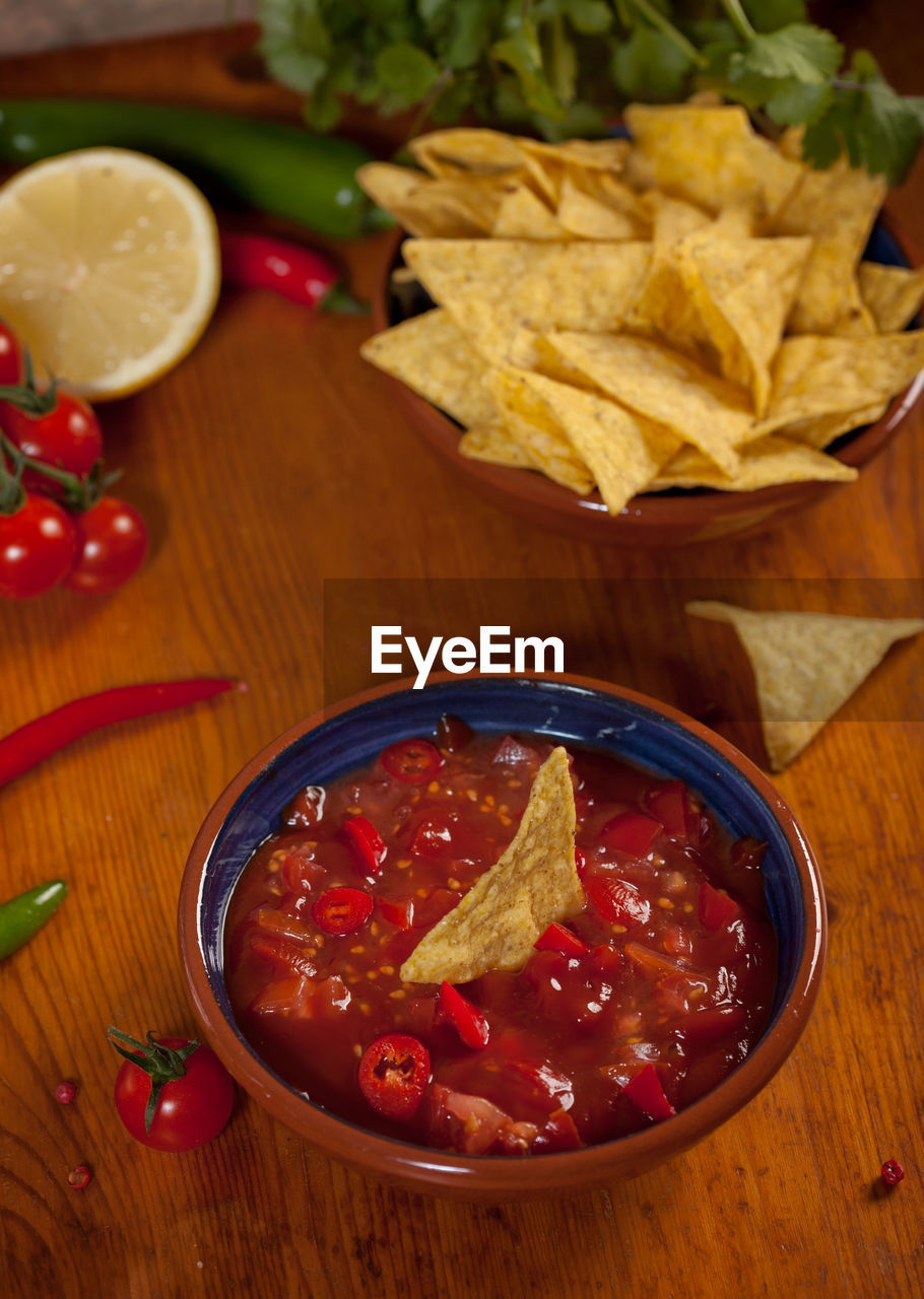 Close-up of nachos with sauce on table