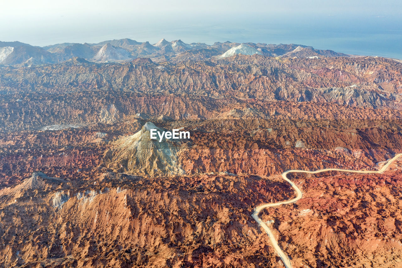 High angle view of sun shining over land