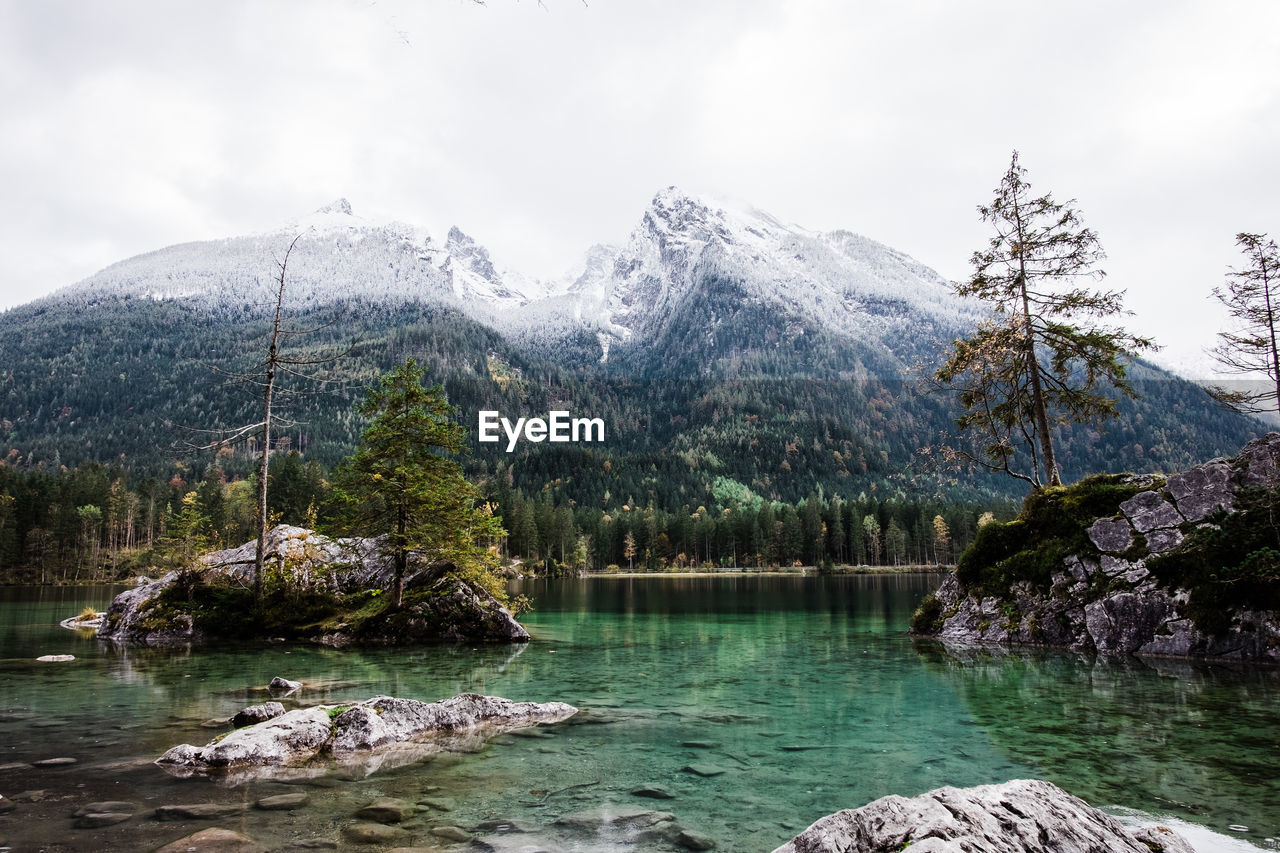 SCENIC VIEW OF LAKE AGAINST MOUNTAIN RANGE