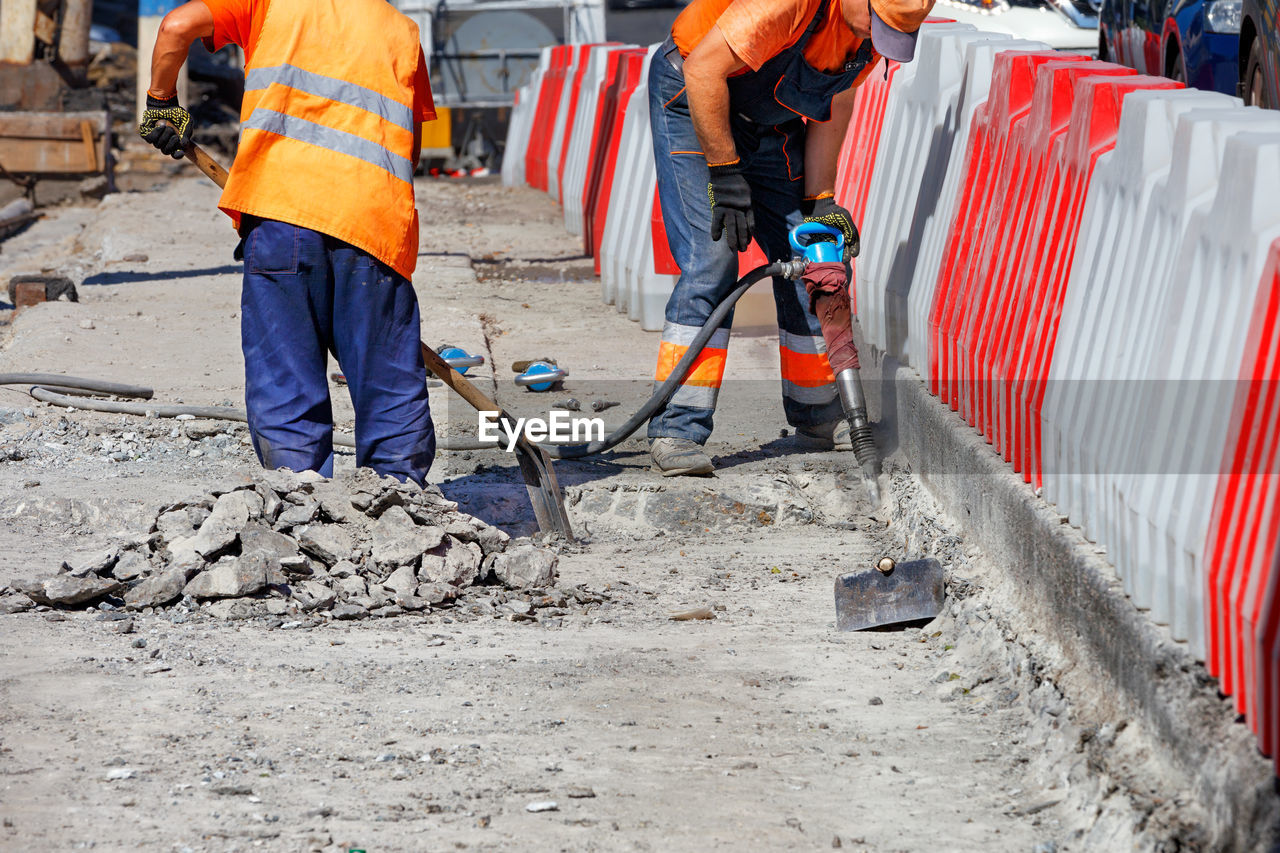 PEOPLE WORKING ON CONSTRUCTION SITE