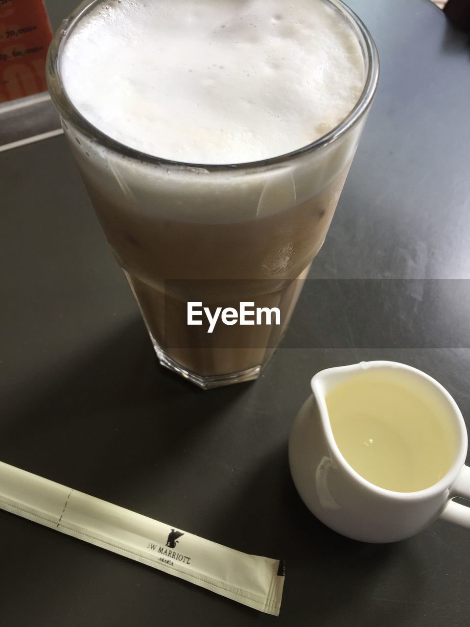 CLOSE-UP OF COFFEE AND DRINK ON TABLE