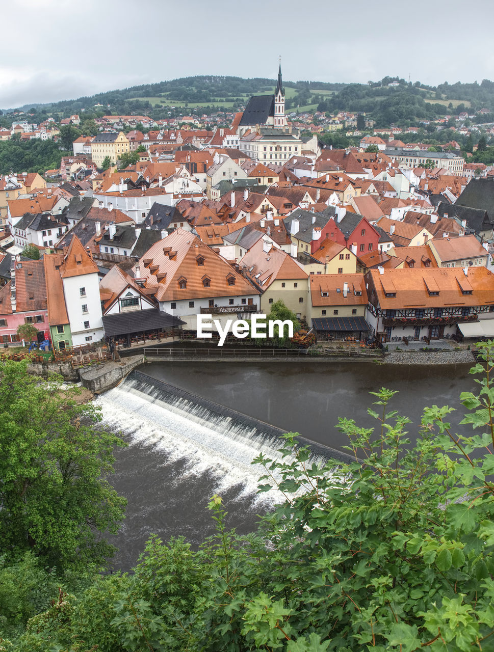 Tower of castle and rooftops in old town of cesky krumlov. 14th of july 2019, czech republic.