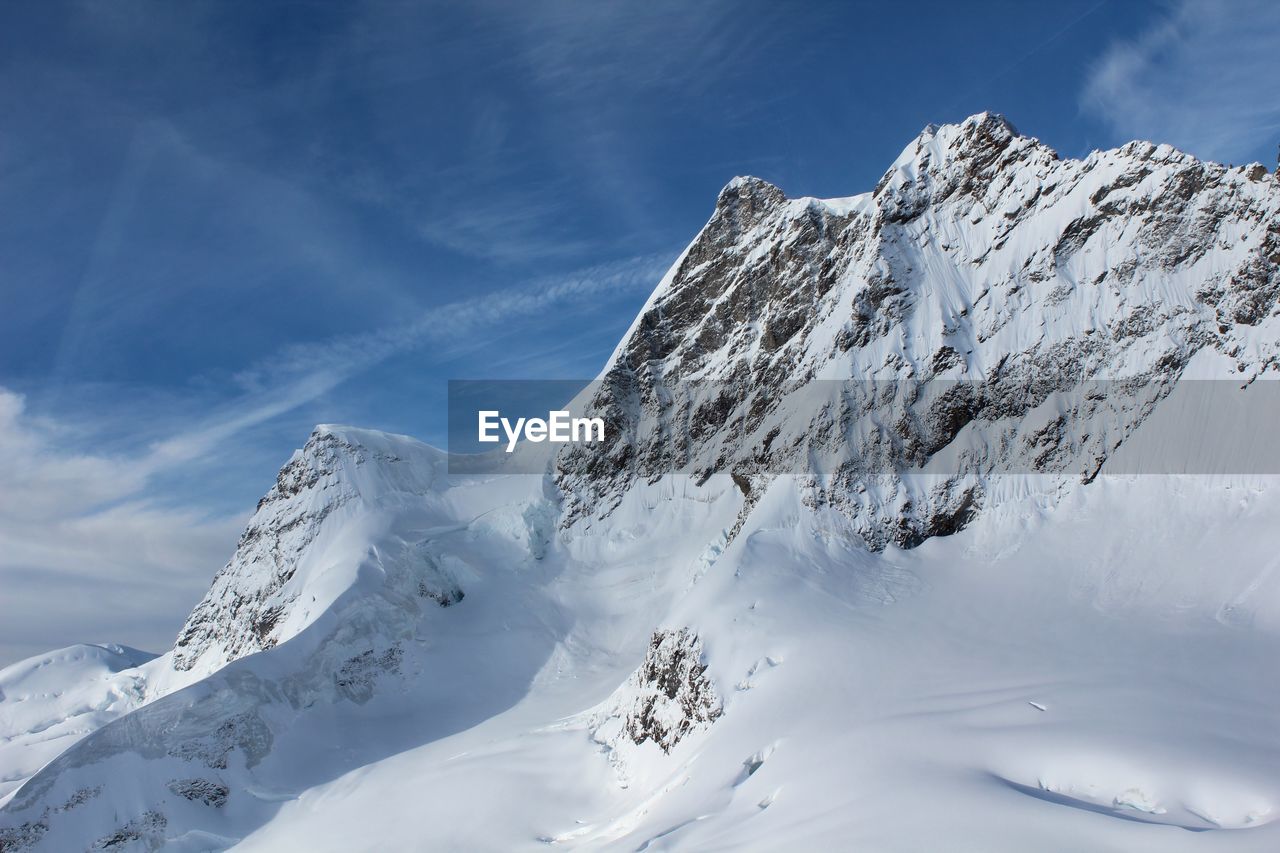 Snowcapped mountains against sky