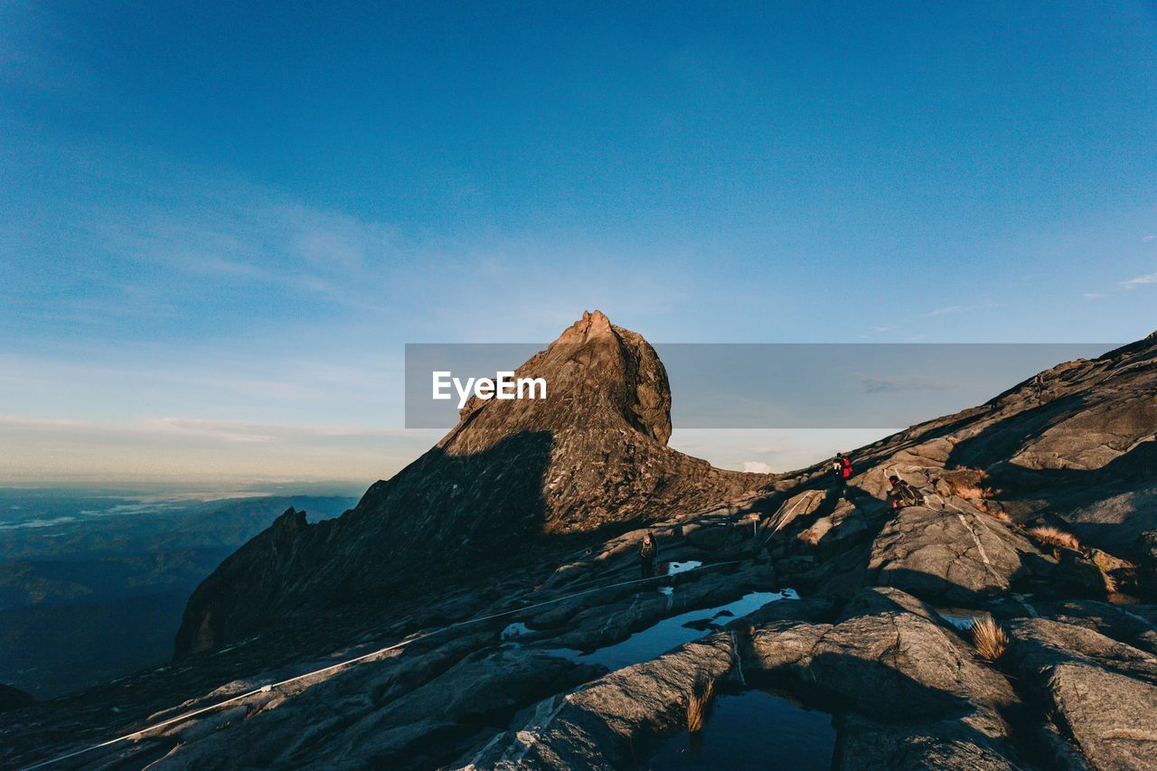 SCENIC VIEW OF ROCK AGAINST SKY