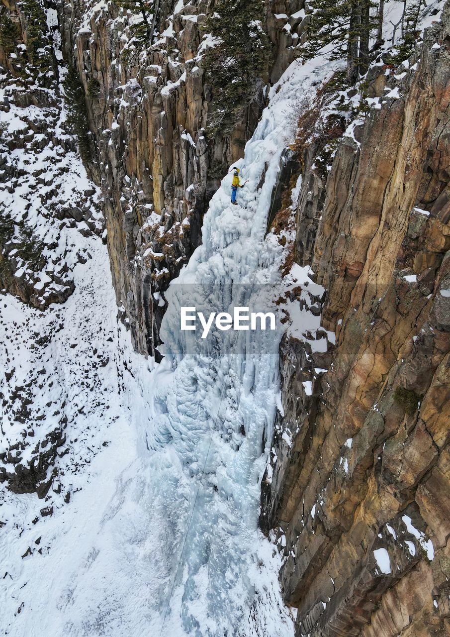 An ice climber in hyalite canyon near bozeman, montana. 