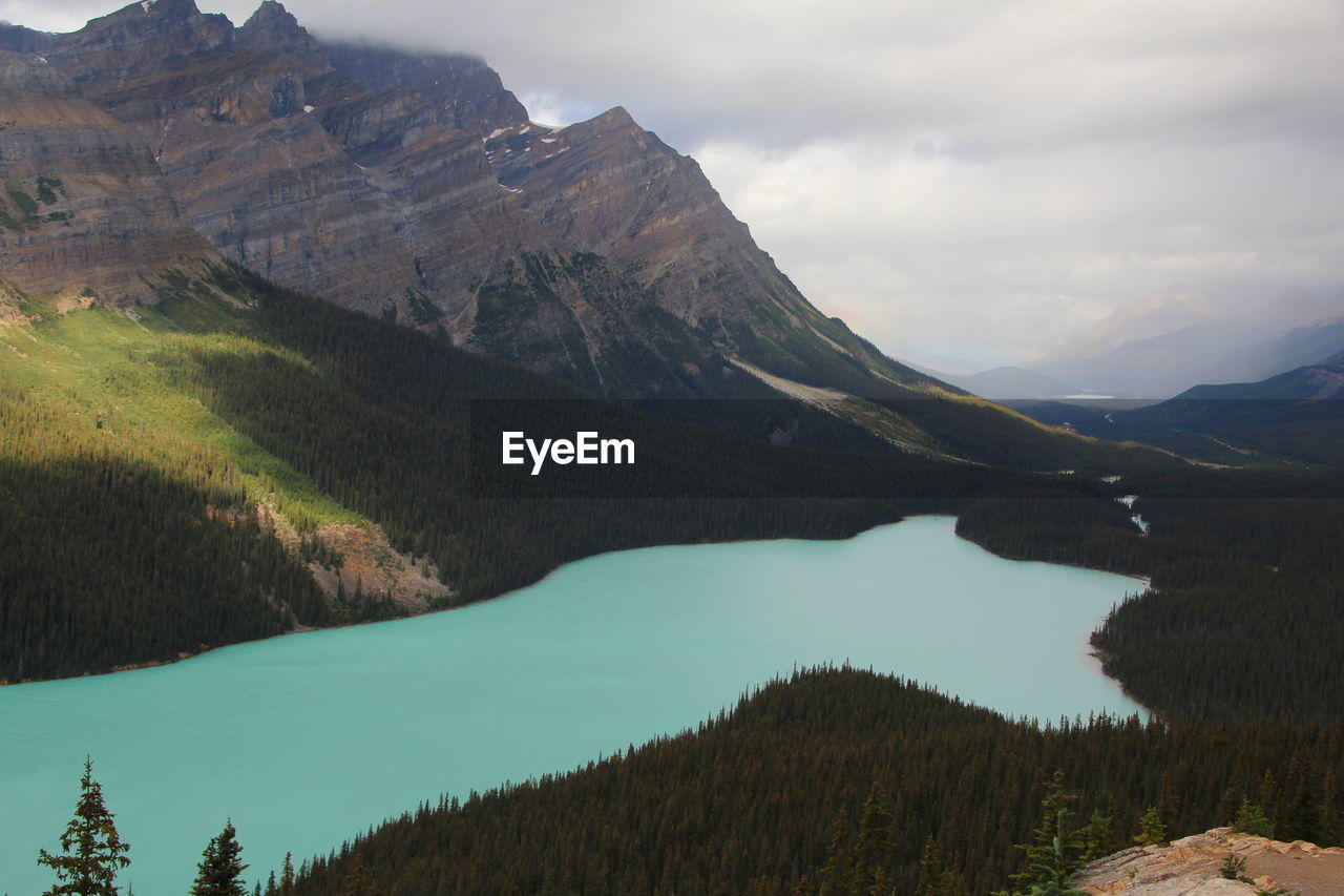 Scenic view of lake against cloudy sky