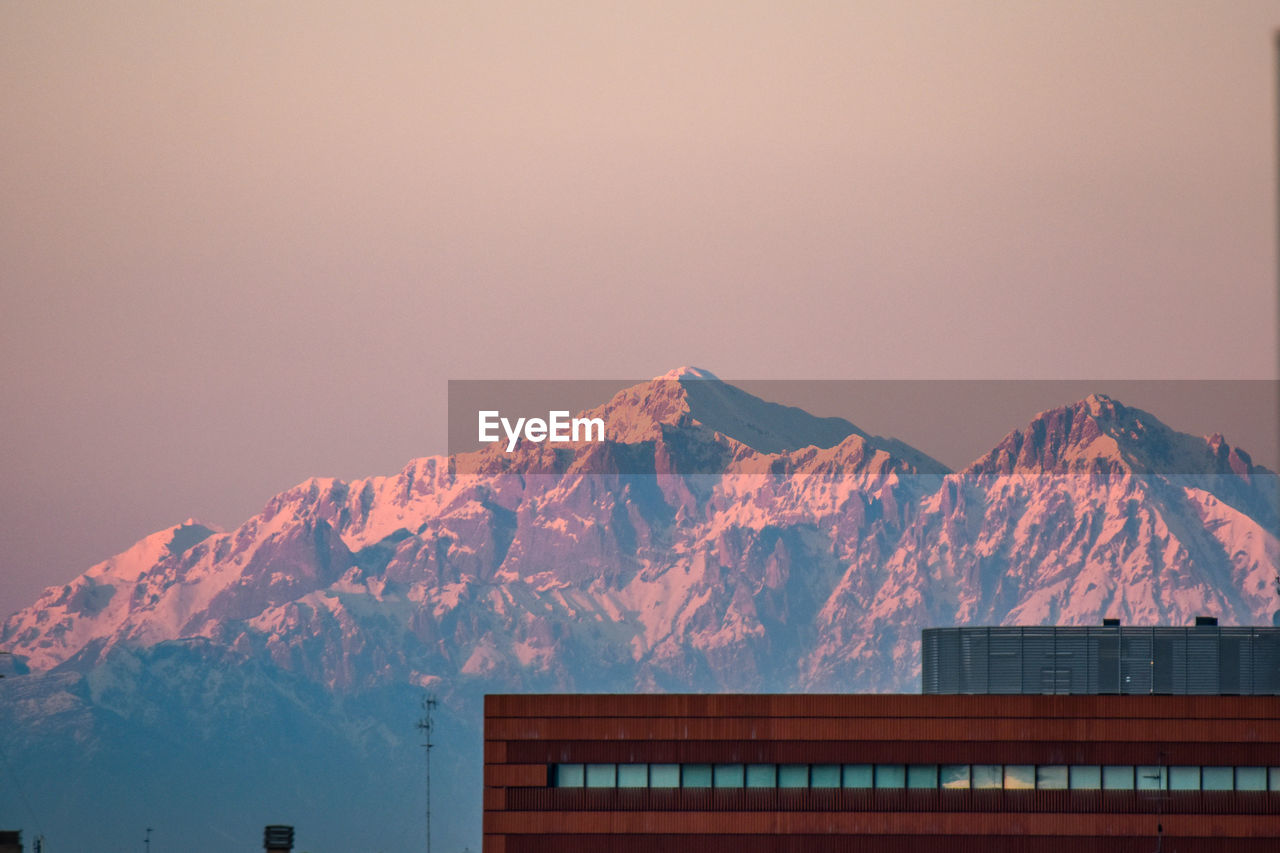 SCENIC VIEW OF SNOWCAPPED MOUNTAIN AGAINST SKY DURING WINTER