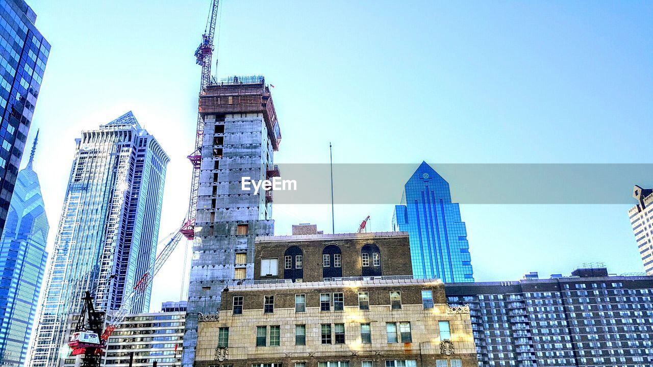 LOW ANGLE VIEW OF BUILDINGS AGAINST CLEAR SKY