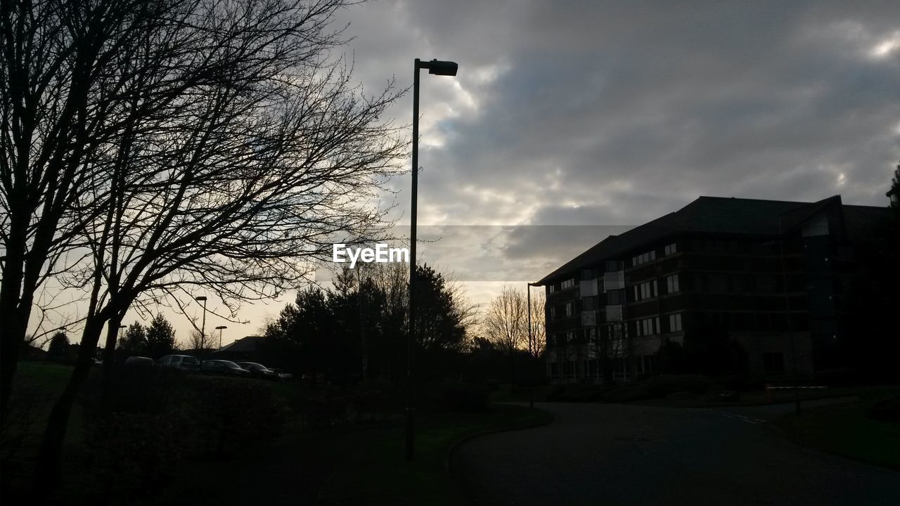 View of street light against cloudy sky