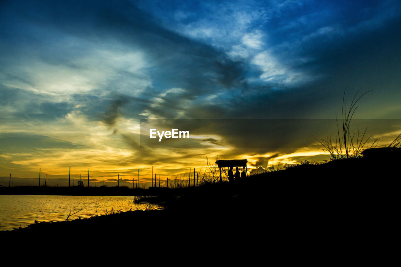 Scenic view of dramatic sky over sea during sunset