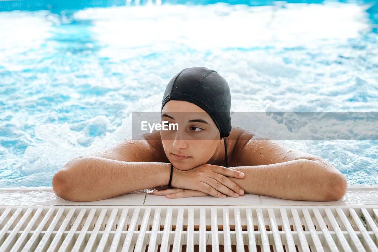 Young woman enjoying thermal bath in a spa center person