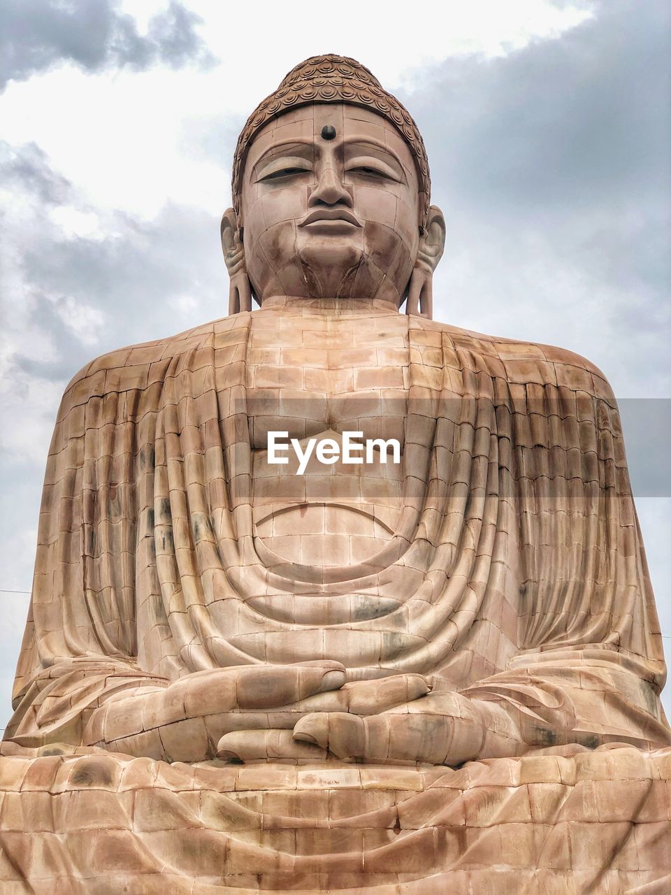 Low angle view of buddha in mediation 