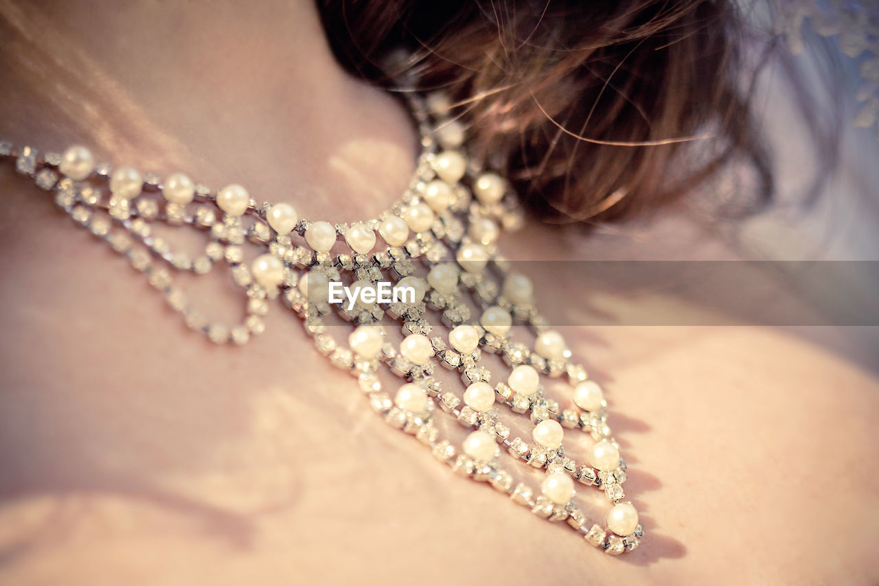 Close-up of woman wearing necklace