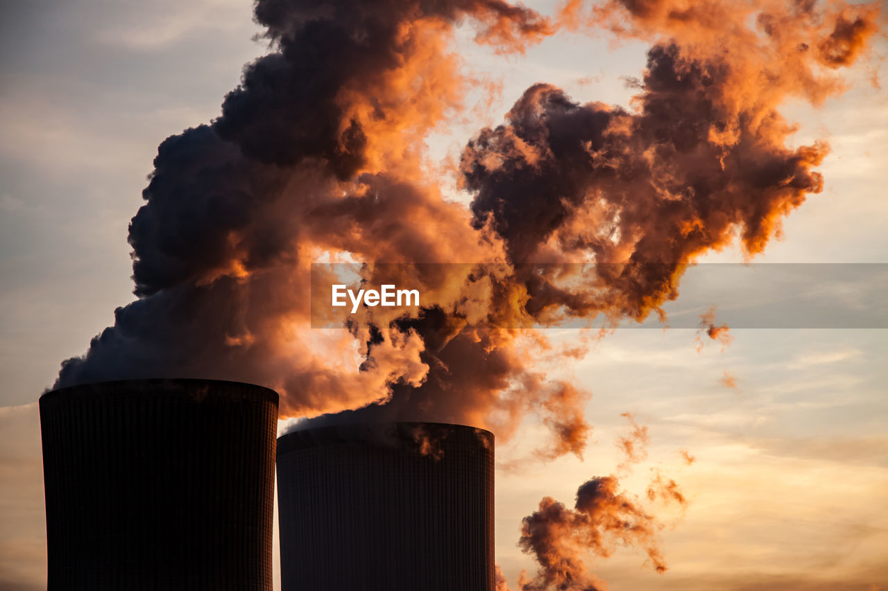 SMOKE EMITTING FROM CHIMNEY AGAINST SKY